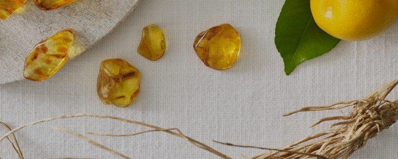 a close up of a lemon slice on a table next to a mirror