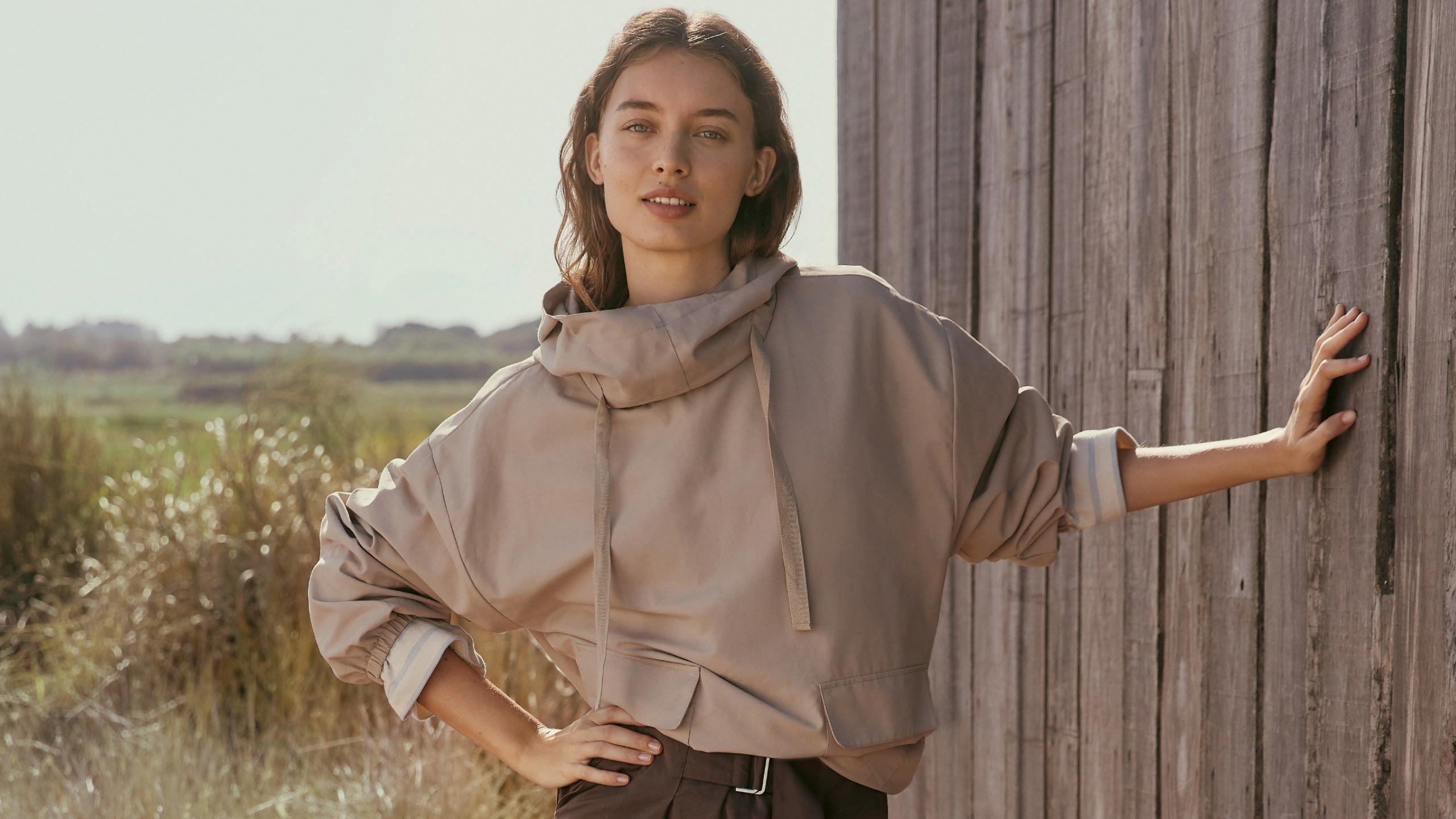 three women are smiling and laughing together