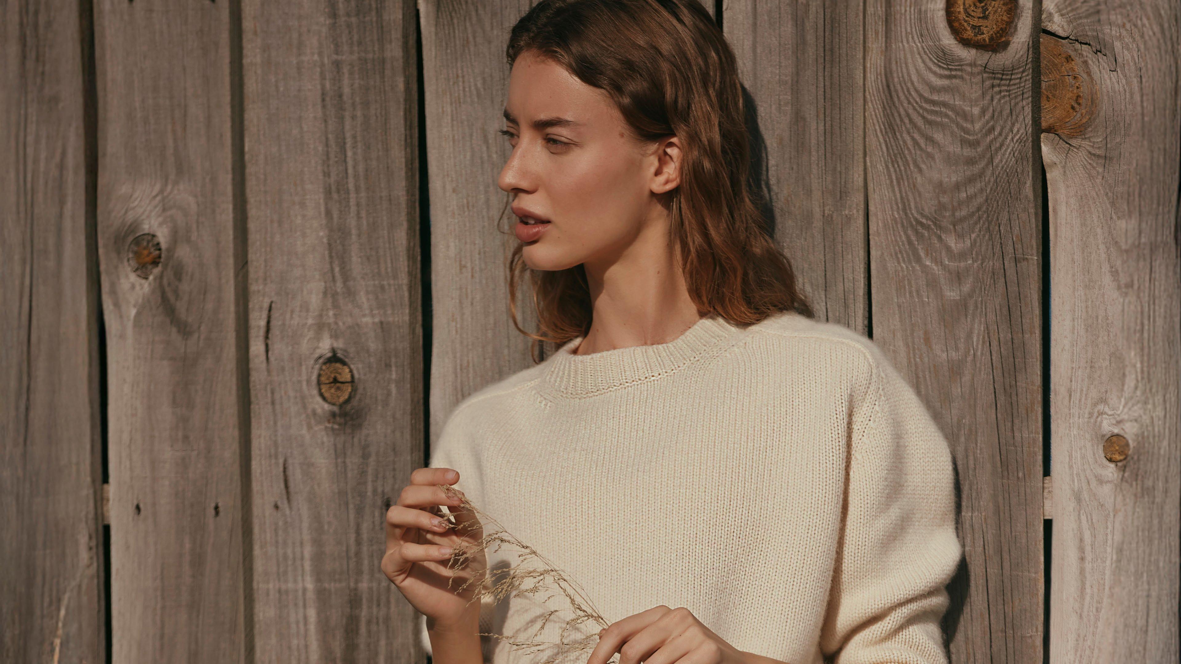 three women are smiling and laughing together