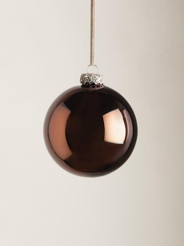 a brown christmas ball hanging from a string