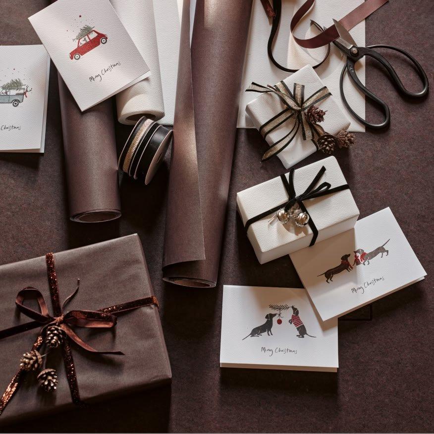 a bunch of wrapping paper and scissors on a table