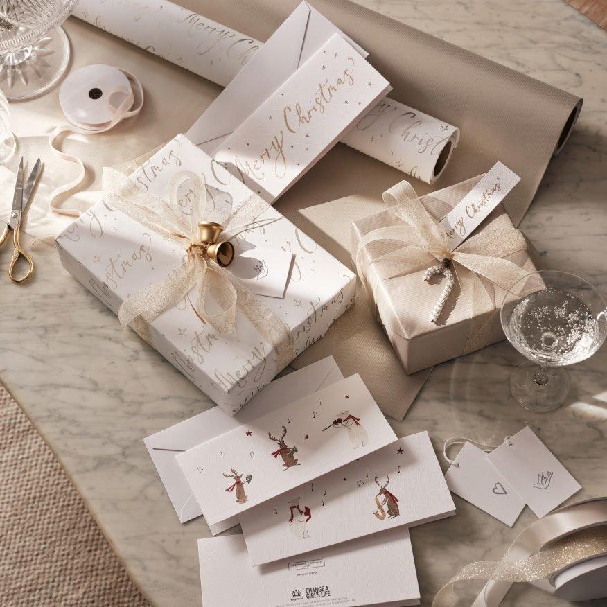 a table with a bunch of presents and scissors on it