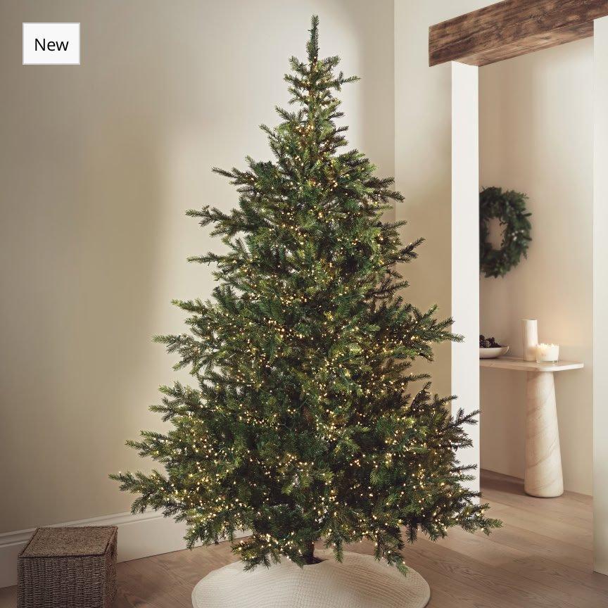 a christmas tree is shown in a room with a white floor