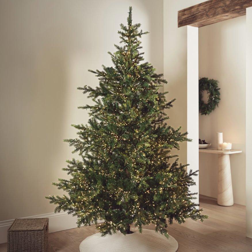 a christmas tree is shown in a room with a white floor