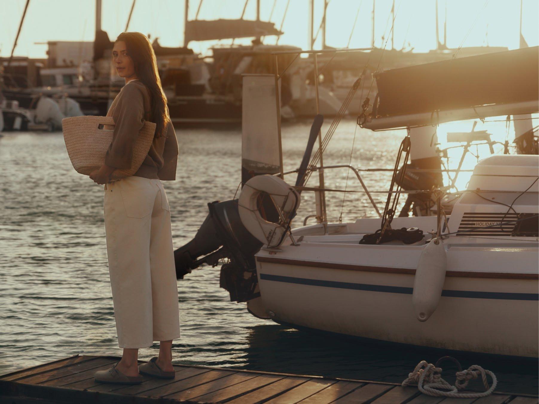 Woman next to boat