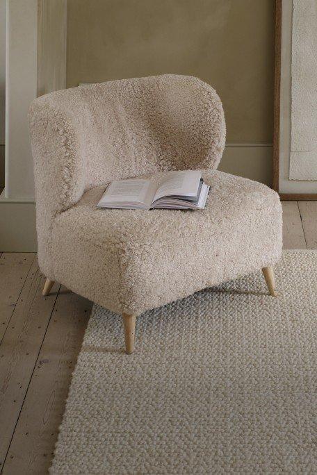 a book is sitting on a chair in a room