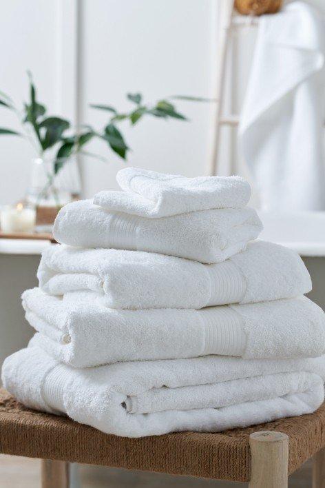 a stack of towels on a stool