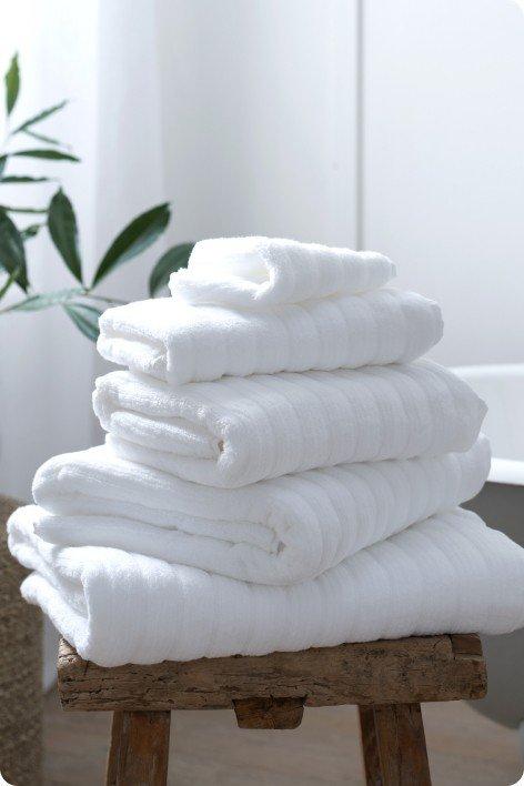 a stack of towels on a stool