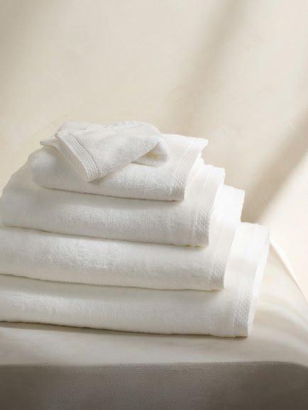 a stack of white towels 