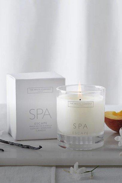 a candle with a label that says sicilian orange