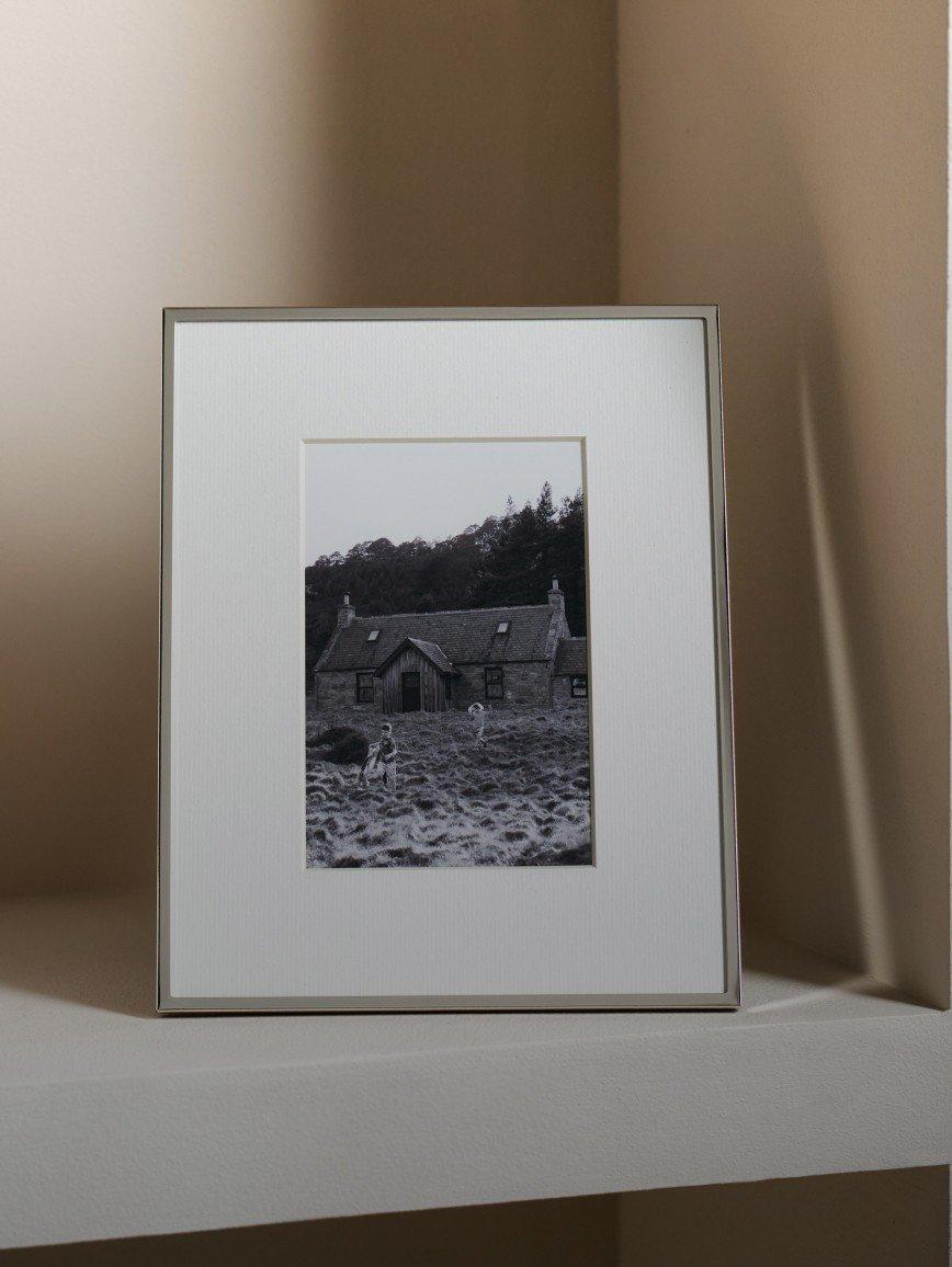 a picture of a picture of a house on a shelf