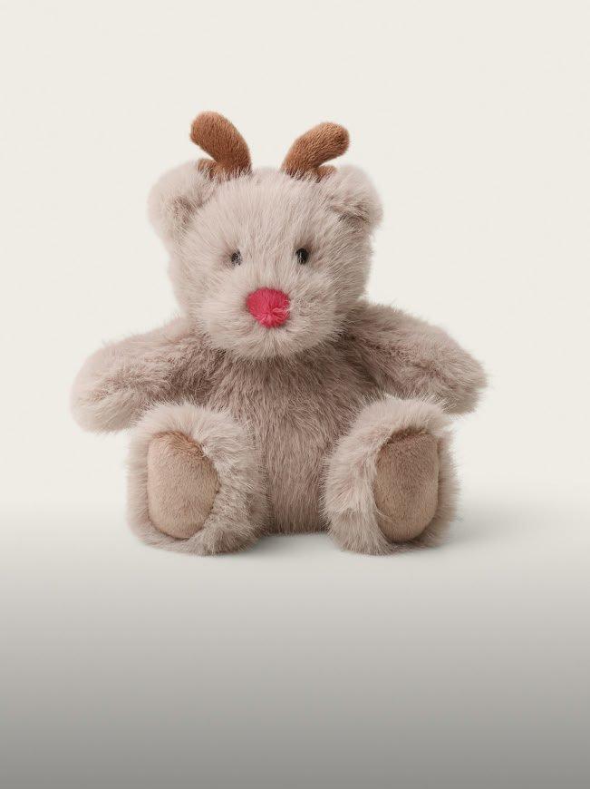 a small stuffed animal with a red nose and antlers