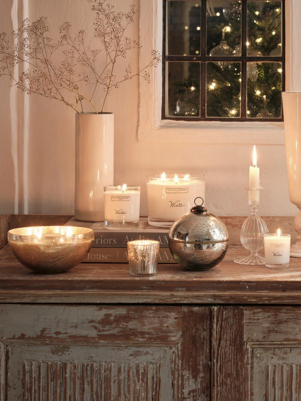 a wooden table with candles and other items on it