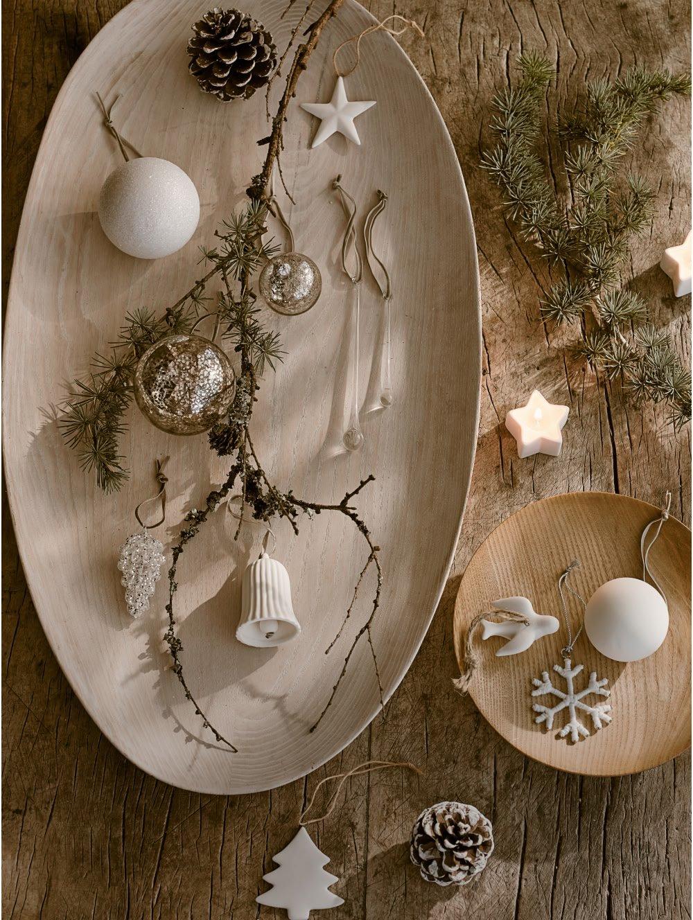 a wooden table with a plate of decorations on it